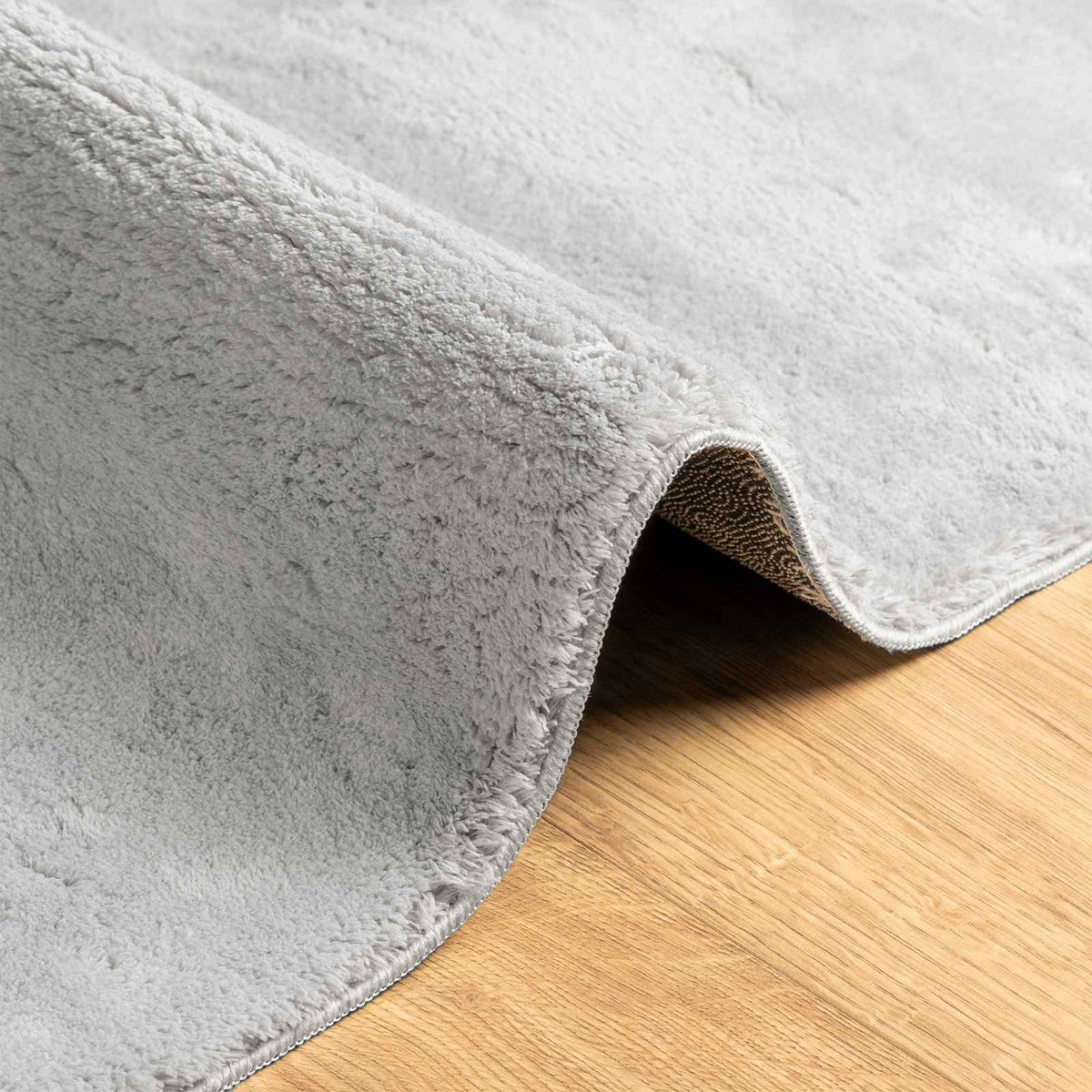 Srednje pahuljasti, mekana i periva prostirka HUARTE Siva 80 x 500 cm